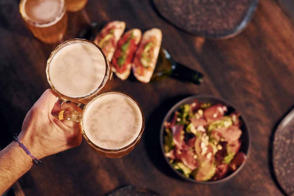 Close up view of food and beer on the table